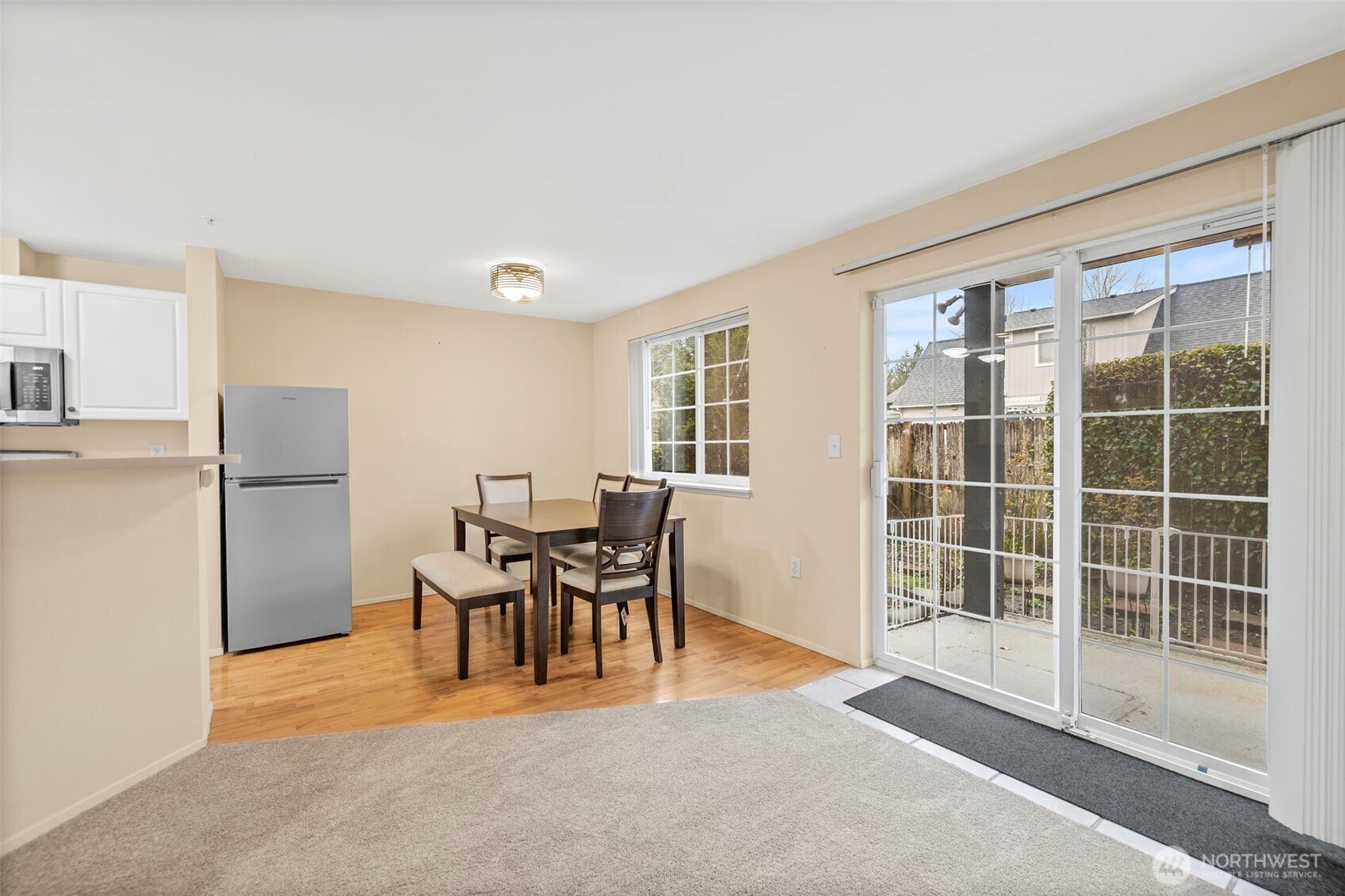 10824 Southeast 170th Street, Unit B103 Renton, WA 98055 - Photo 8 of 31 a view of a livingroom with furniture and a window