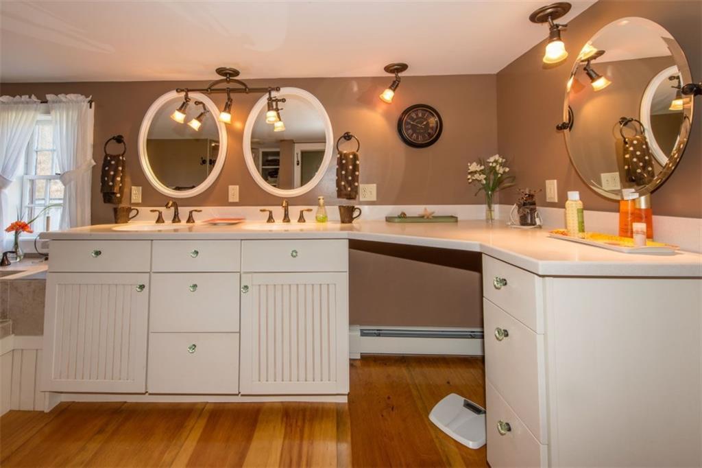 49 Meadow Cove Road Boothbay, ME 04544 - Photo 20 of 35 The master bathroom with twin Corian...