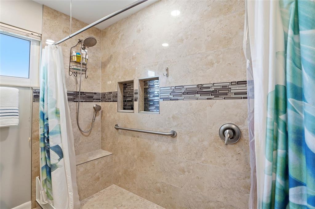 6641 12th Avenue North St. Petersburg, FL 33710 - Photo 12 of 18 a bathroom with a shower