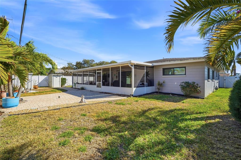 6641 12th Avenue North St. Petersburg, FL 33710 - Photo 15 of 18 a house with swimming pool in front of it