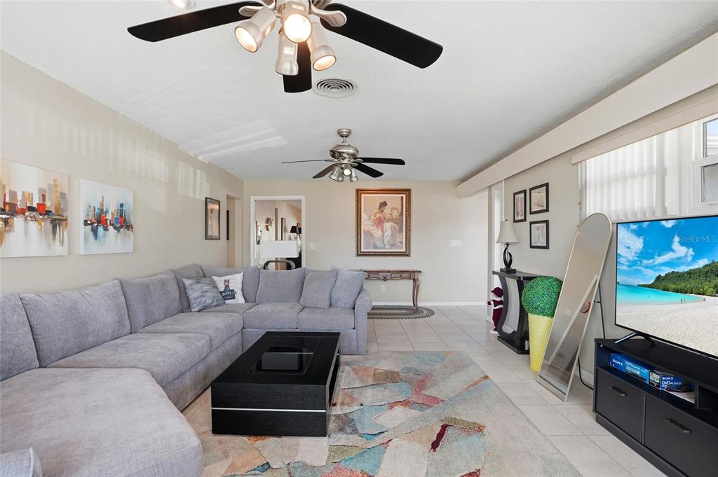 6641 12th Avenue North St. Petersburg, FL 33710 - Photo 6 of 18 a living room with furniture and a couch