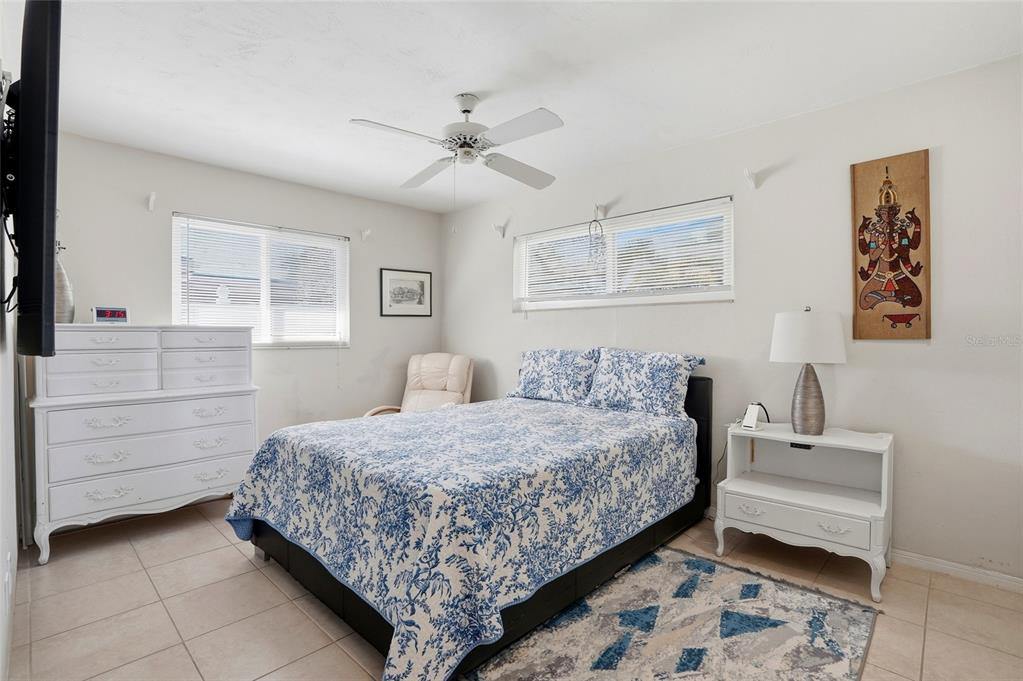 6641 12th Avenue North St. Petersburg, FL 33710 - Photo 10 of 18 a bedroom with a bed and a dresser