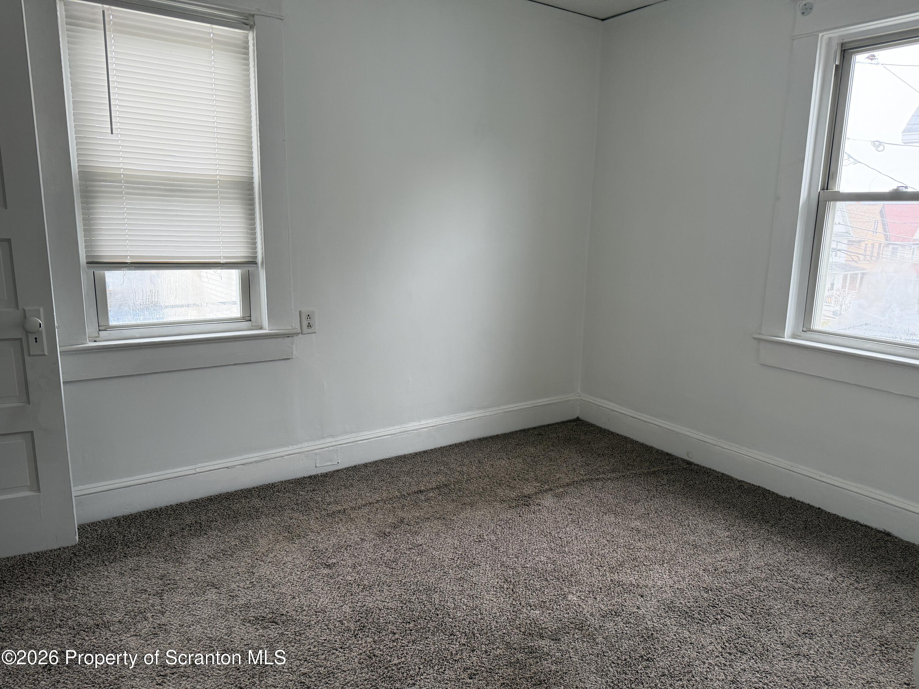 2031 Delaware Street, Unit 2 Dunmore, PA 18512 - Photo 6 of 10 an empty room with a window