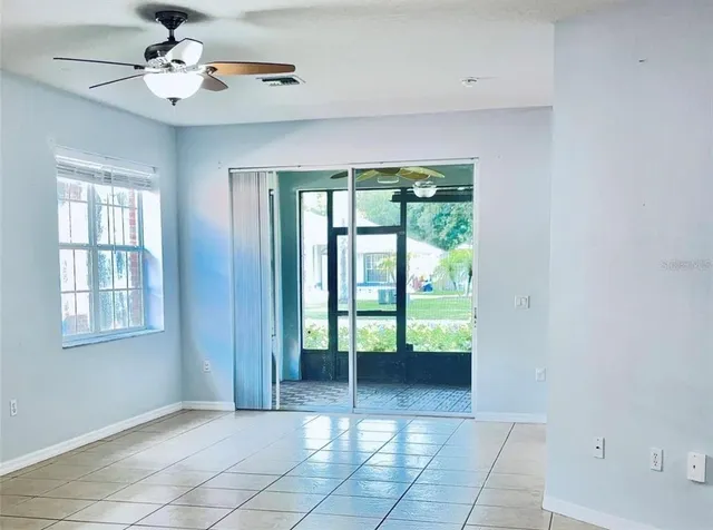 a view of an entryway with a ceiling fan