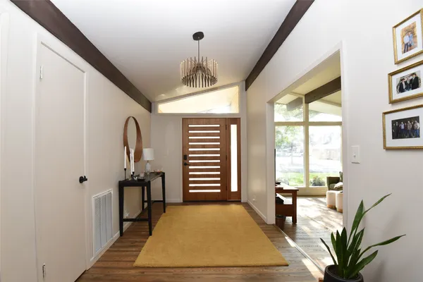 a bedroom with furniture and a window