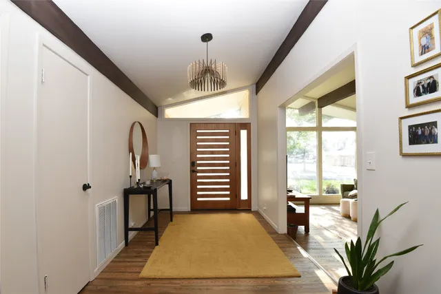 a bedroom with furniture and a window