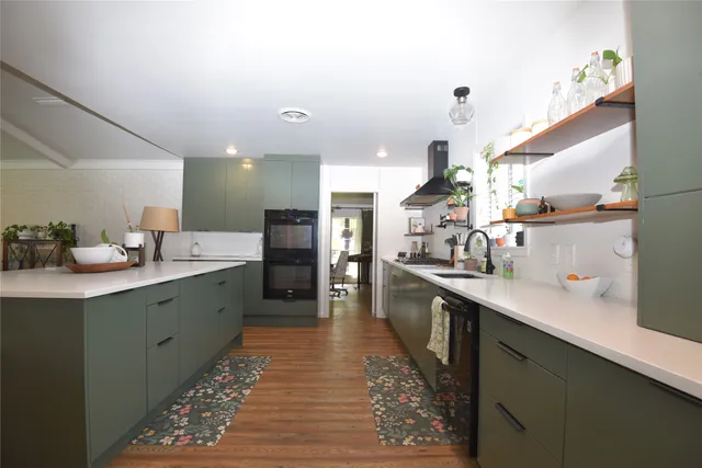 a kitchen with sink and cabinets