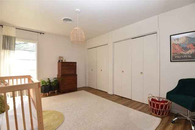 a bedroom with furniture and a window