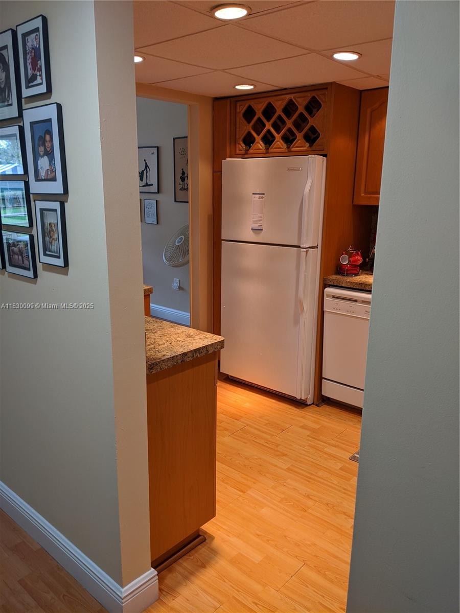 900 St Charles Place, Unit L6 Pembroke Pines, FL 33026 - Photo 3 of 10 a kitchen with stainless steel appliances granite countertop a refrigerator and a sink