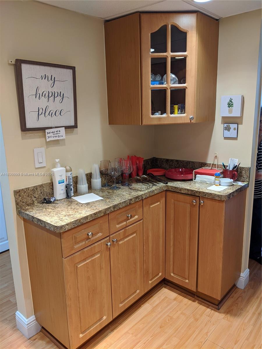 900 St Charles Place, Unit L6 Pembroke Pines, FL 33026 - Photo 5 of 10 a kitchen with stainless steel appliances granite countertop a sink stove and cabinets