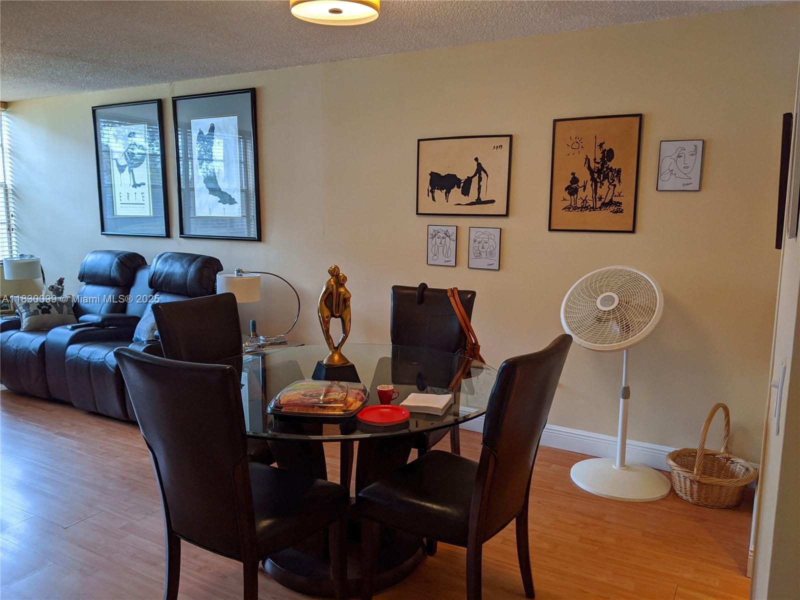 900 St Charles Place, Unit L6 Pembroke Pines, FL 33026 - Photo 8 of 10 a dining room with furniture and wooden floor