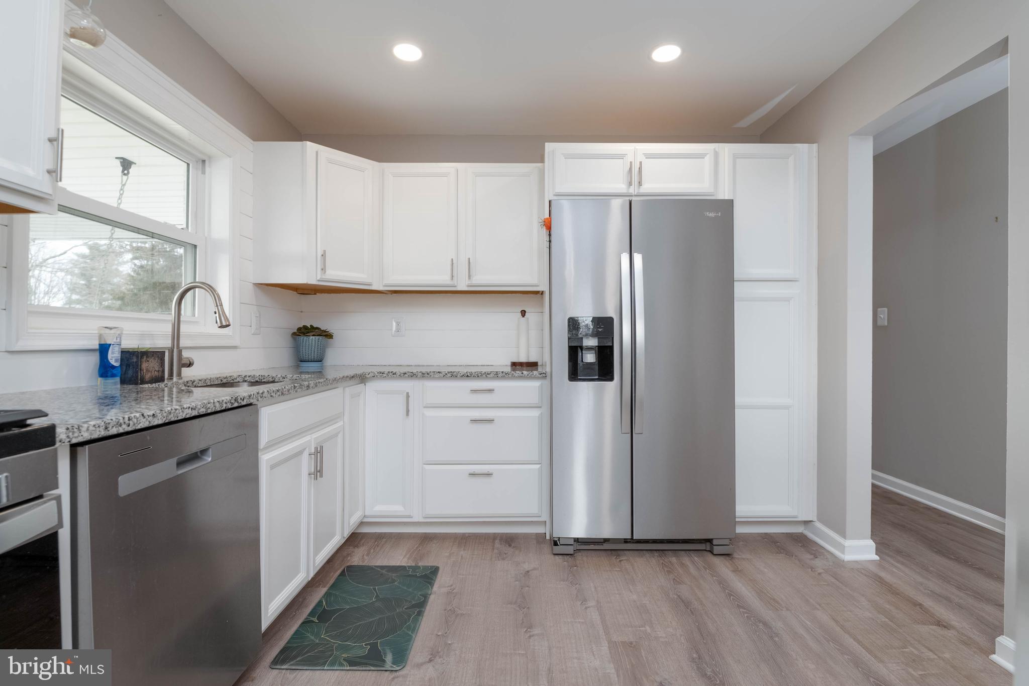 1522 Southview Road Bel Air, MD 21015 - Photo 11 of 42 a kitchen with white cabinets and stainless steel appliances