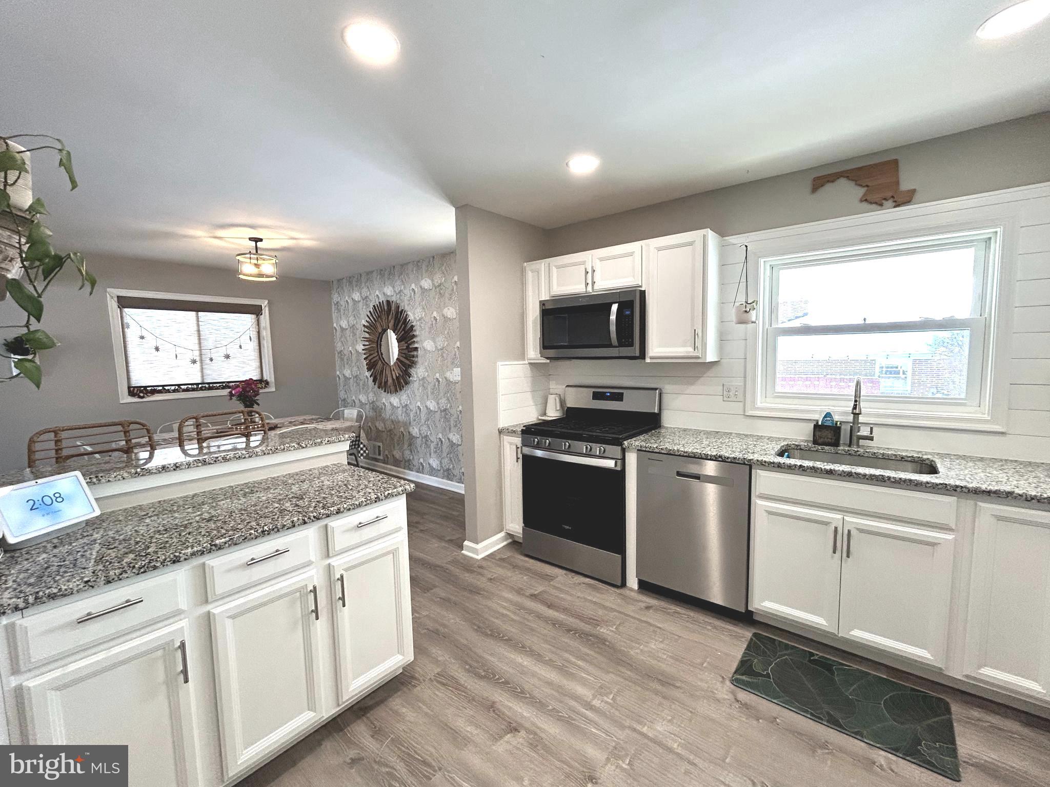 1522 Southview Road Bel Air, MD 21015 - Photo 2 of 7 a kitchen with granite countertop a sink cabinets and stainless steel appliances