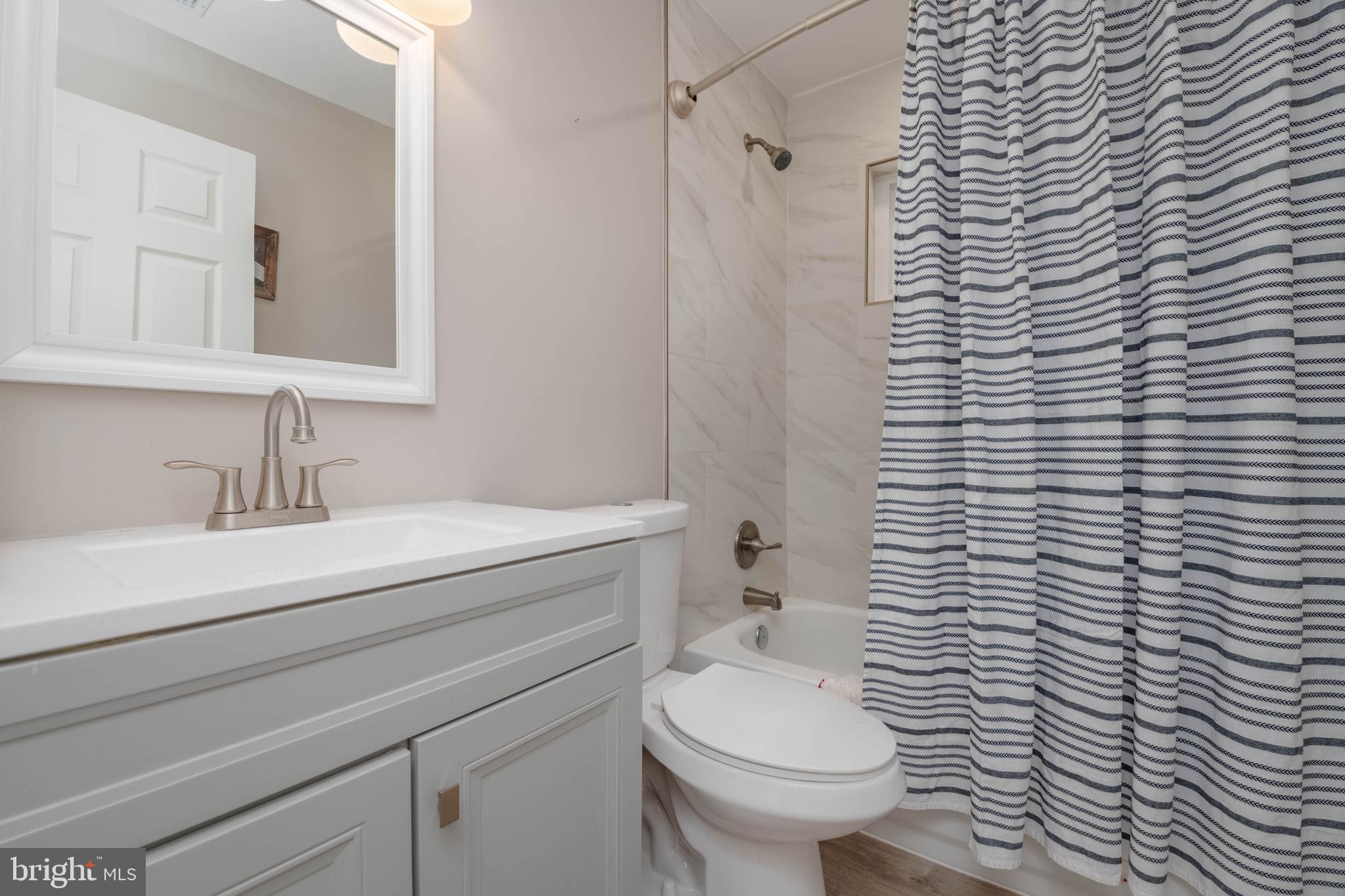1522 Southview Road Bel Air, MD 21015 - Photo 28 of 42 a bathroom with a granite countertop toilet and sink