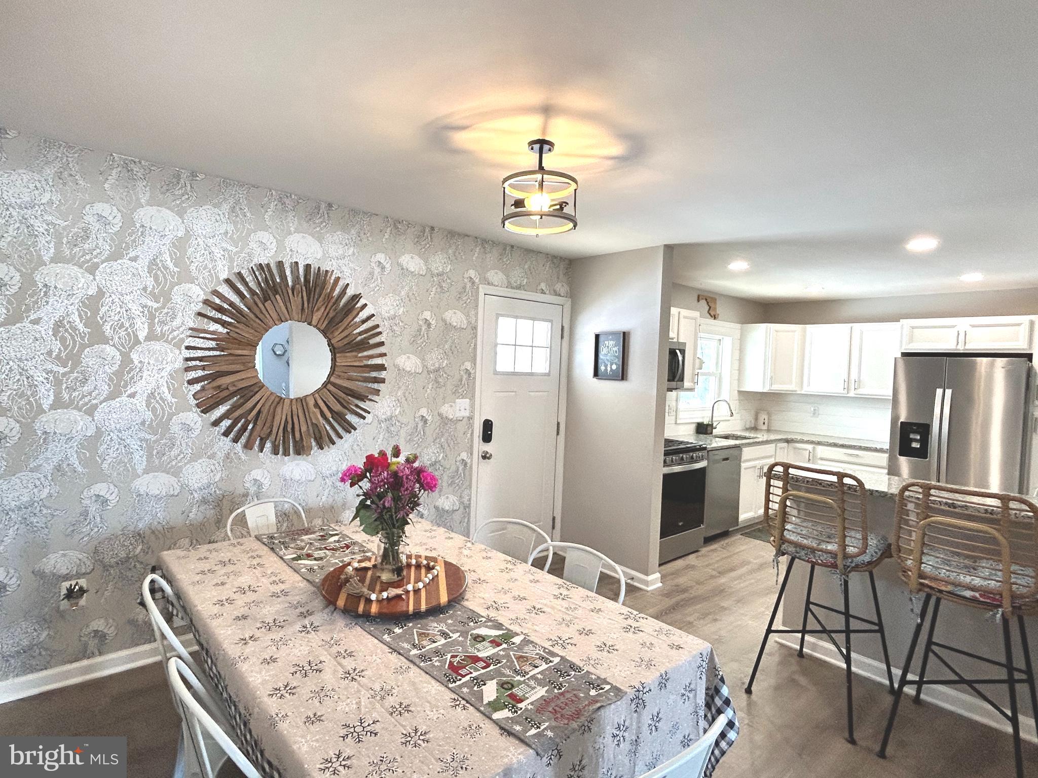 1522 Southview Road Bel Air, MD 21015 - Photo 3 of 7 a view of a dining room with furniture and chandelier