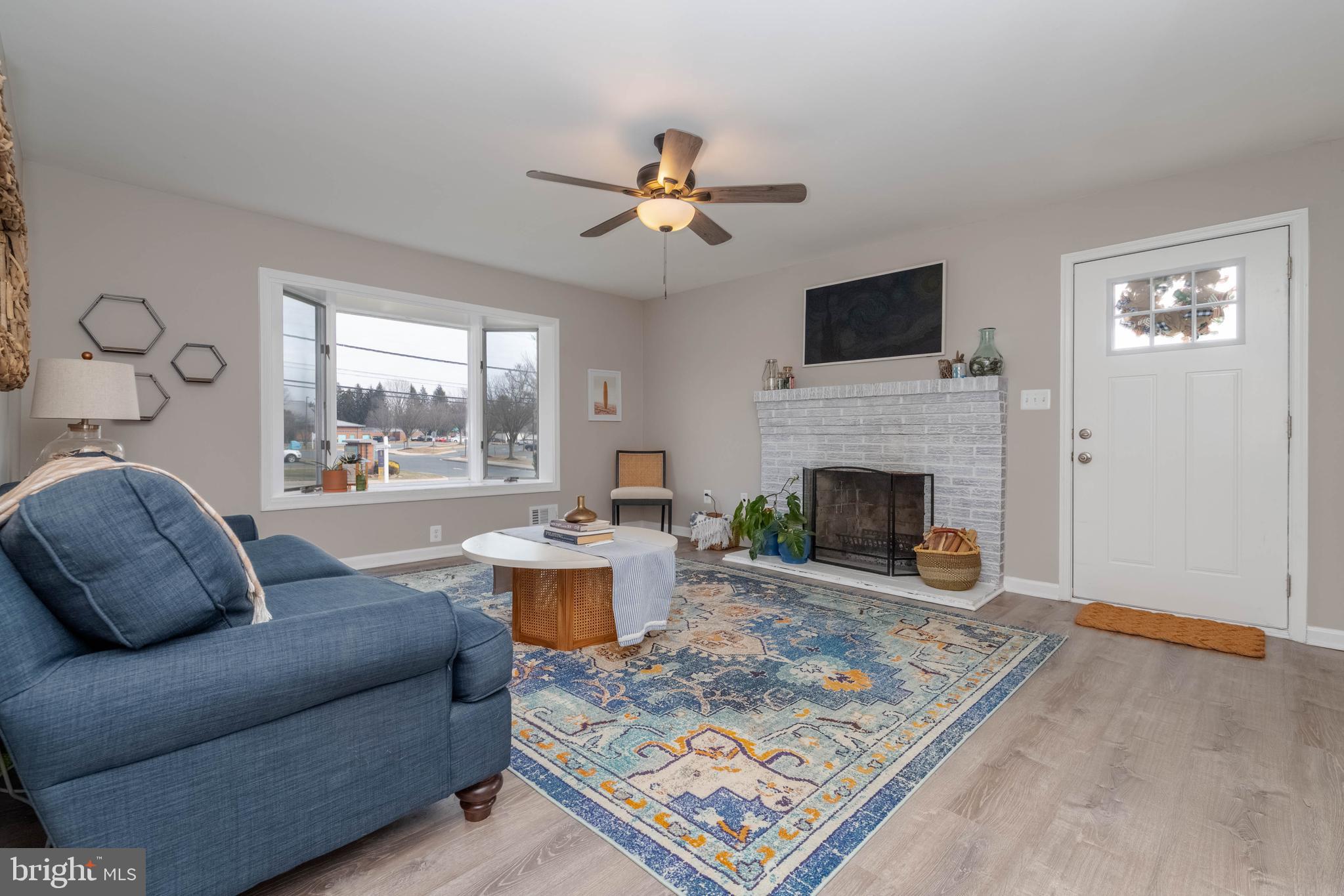 1522 Southview Road Bel Air, MD 21015 - Photo 9 of 42 a living room with furniture a rug and a fireplace