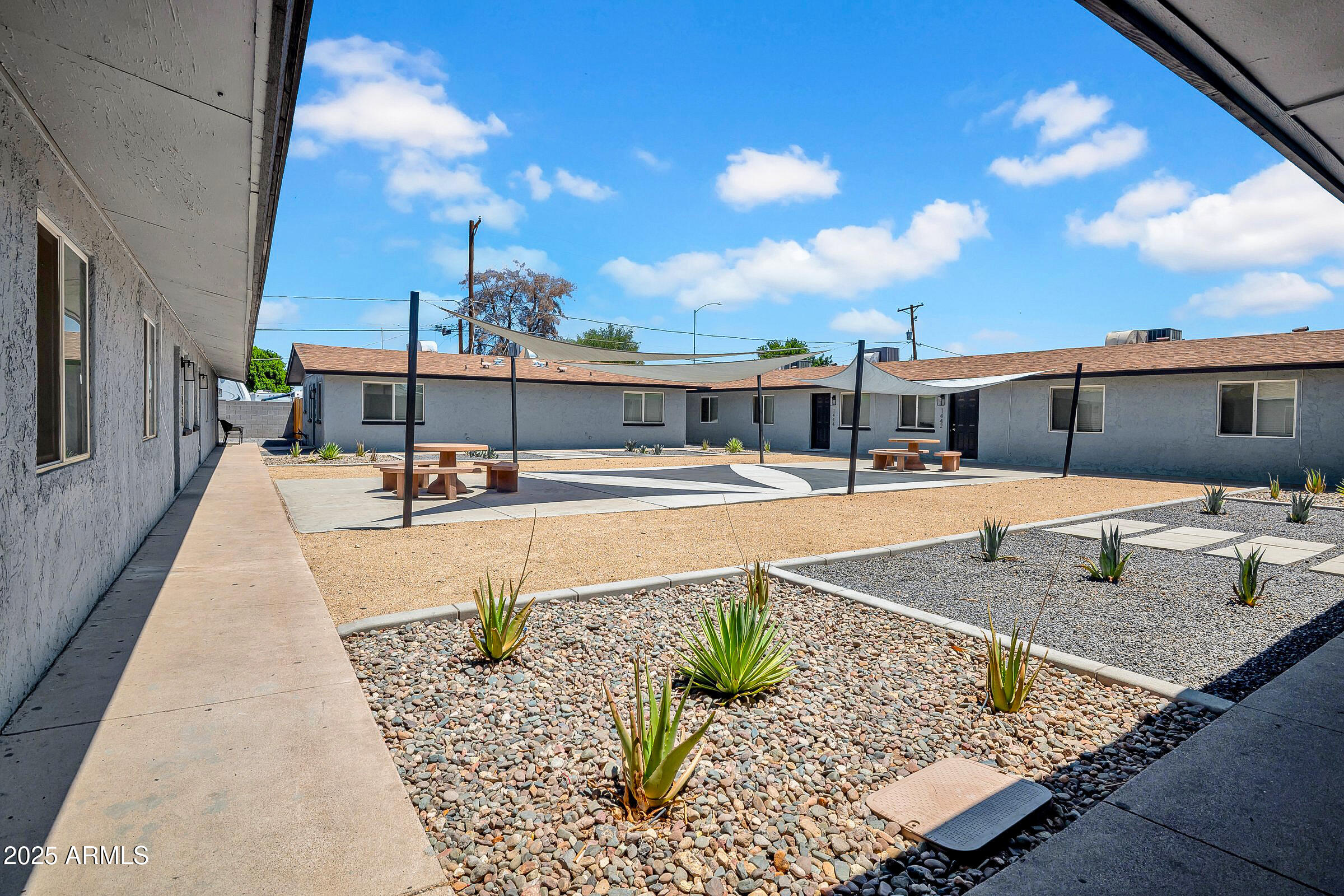 swimming view of a swimming pool with a lounge chairs