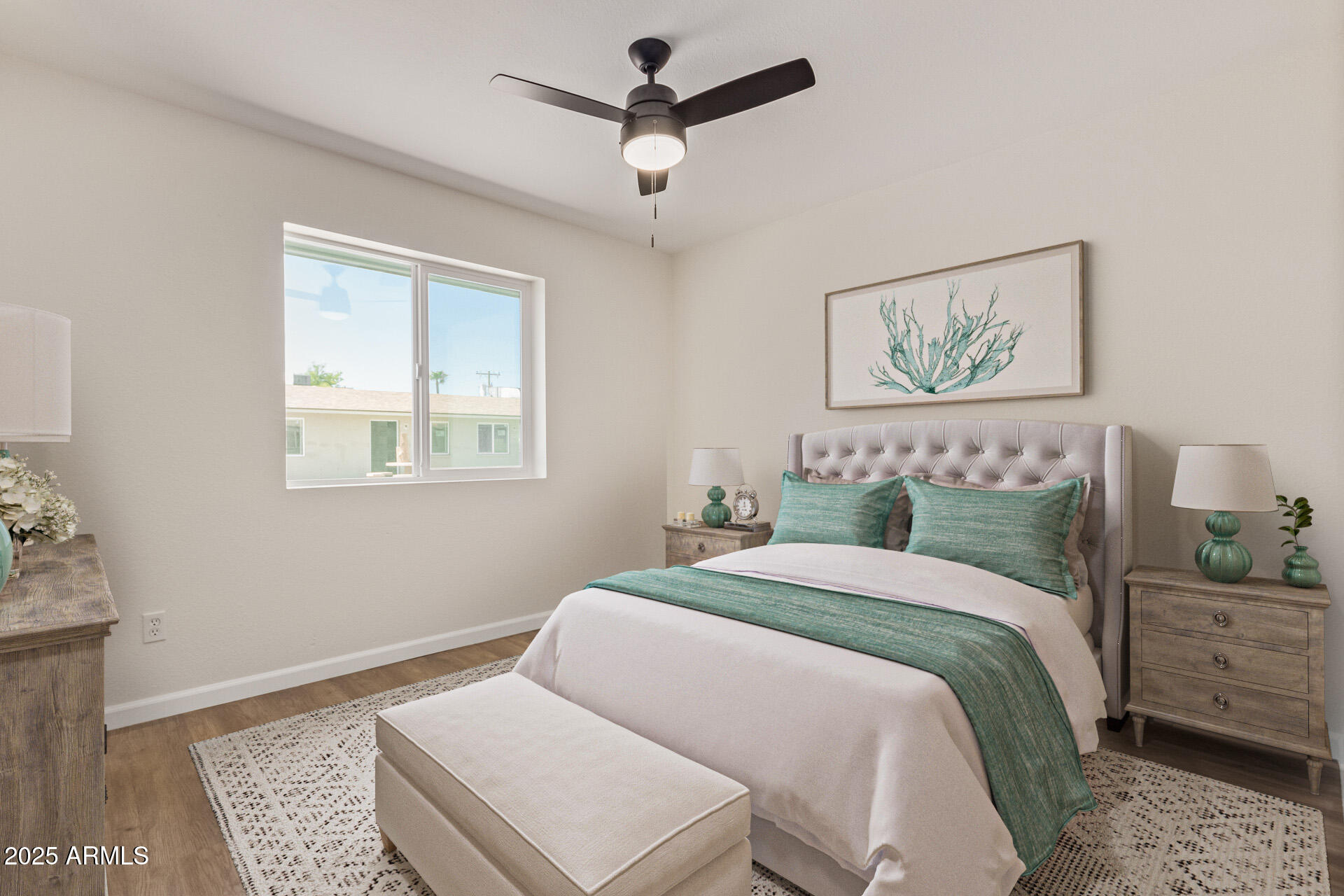 1432 East Broadway Road Mesa, AZ 85204 - Photo 11 of 13 a bedroom with a bed and a painting on the wall