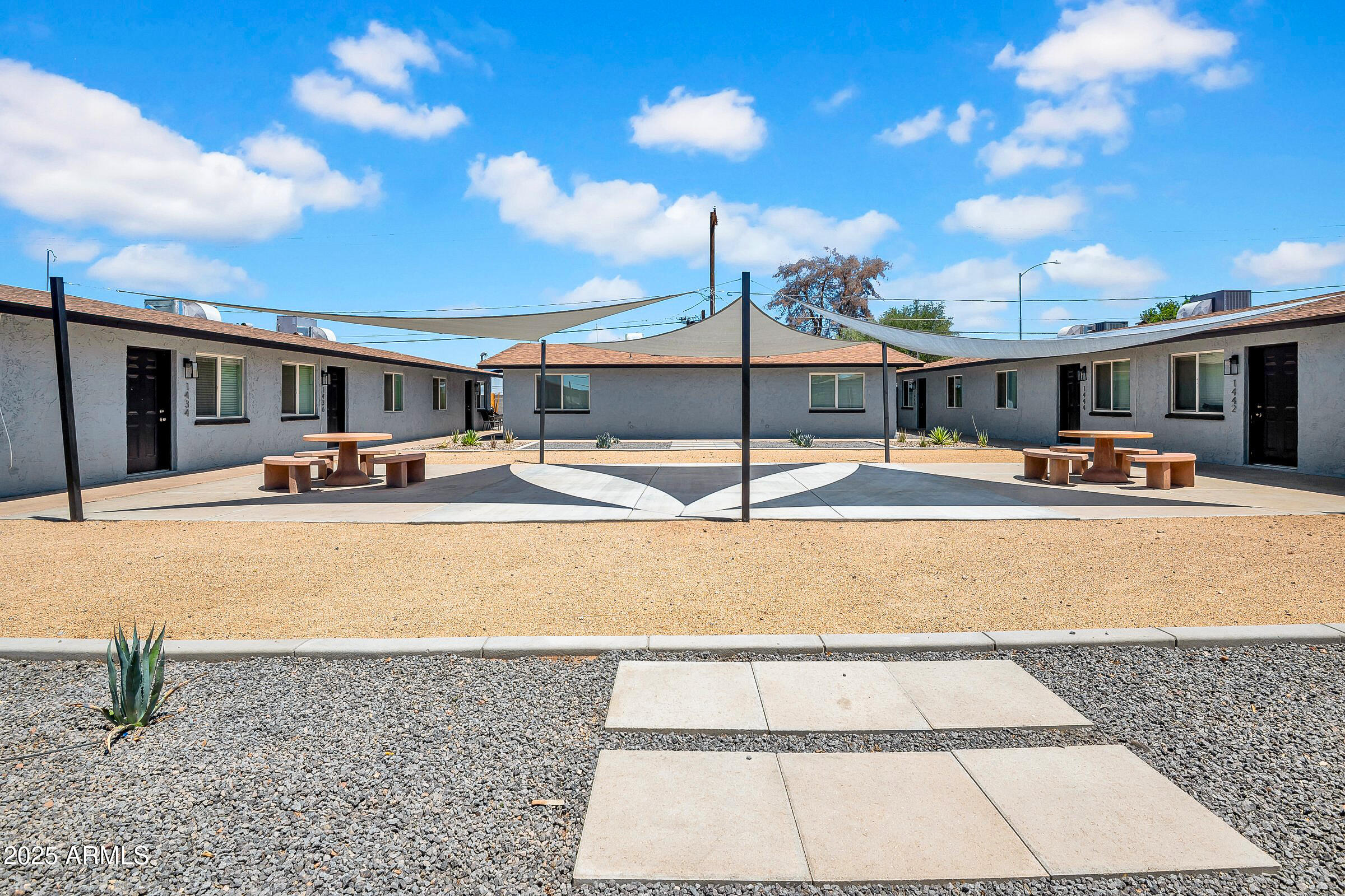 1432 East Broadway Road Mesa, AZ 85204 - Photo 5 of 13 a swimming pool with outdoor seating and yard in the back