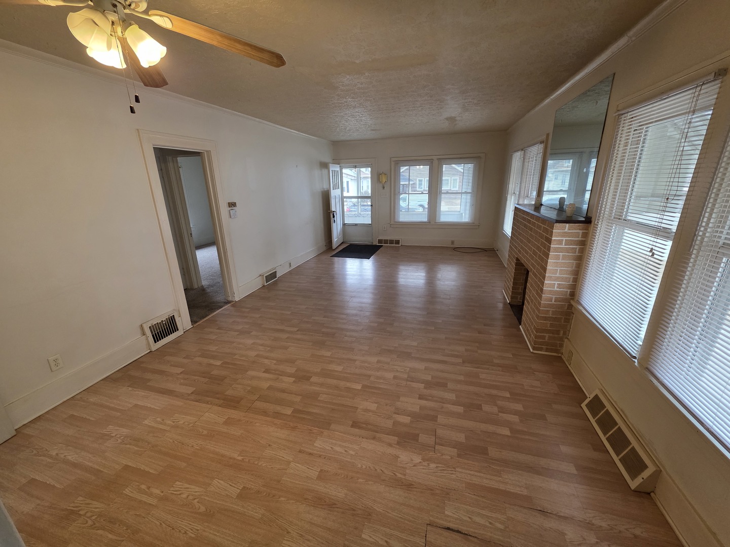 312 East 11th Street Sterling, IL 61081 - Photo 11 of 21 a view of empty room with wooden floor