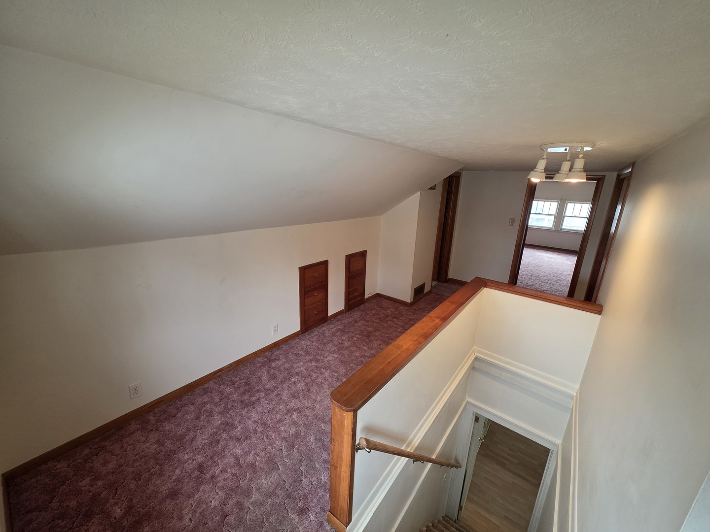 312 East 11th Street Sterling, IL 61081 - Photo 17 of 21 a room with a bed and a mirror