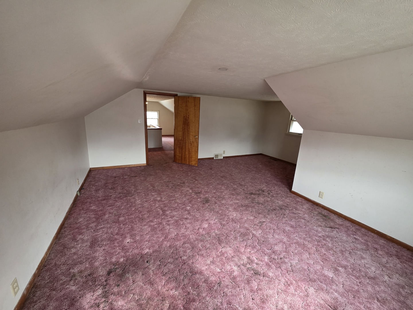 312 East 11th Street Sterling, IL 61081 - Photo 21 of 21 a view of an empty room with window and stairs