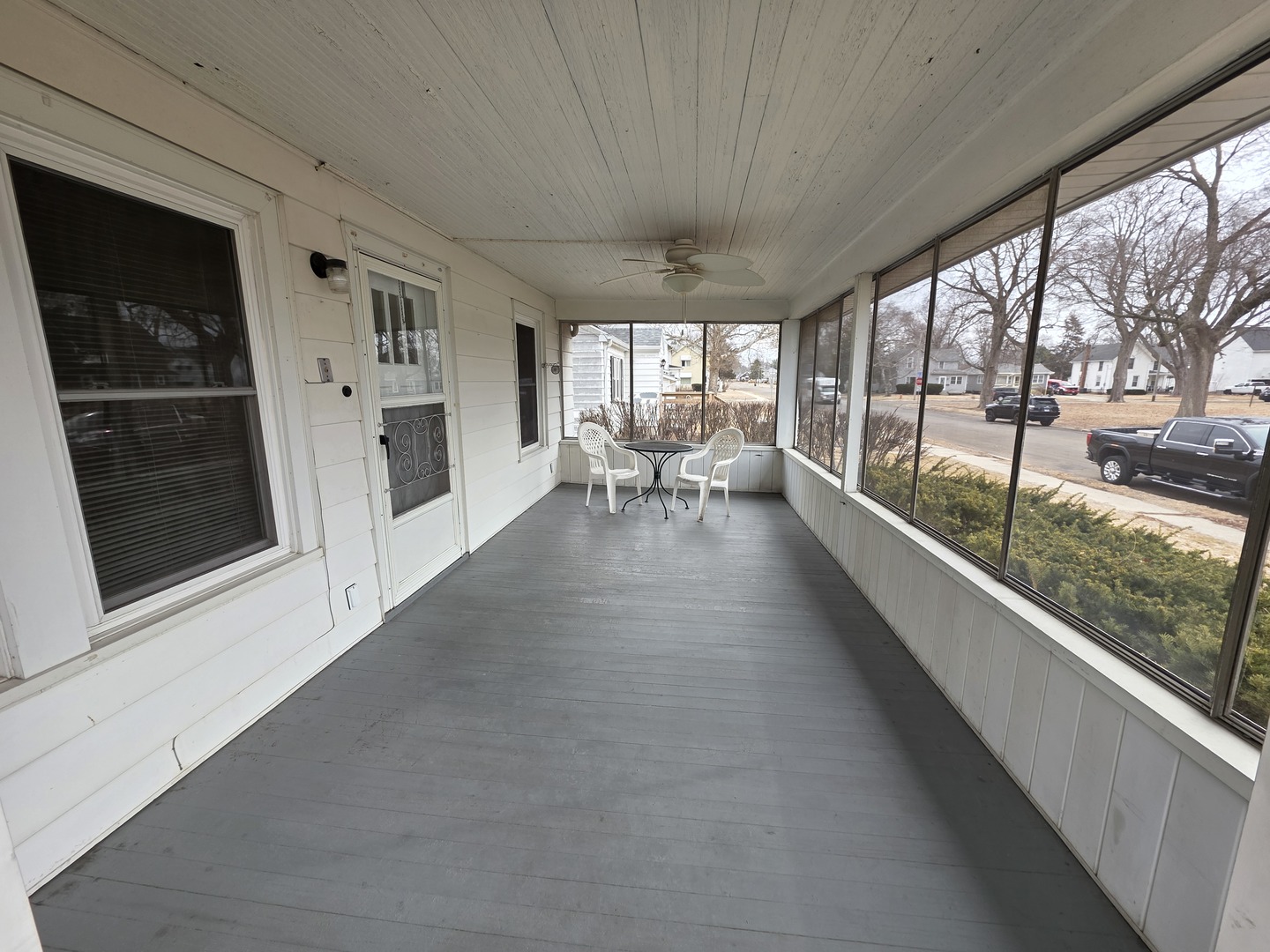 312 East 11th Street Sterling, IL 61081 - Photo 5 of 21 a view of a porch with wooden floor and outdoor seating