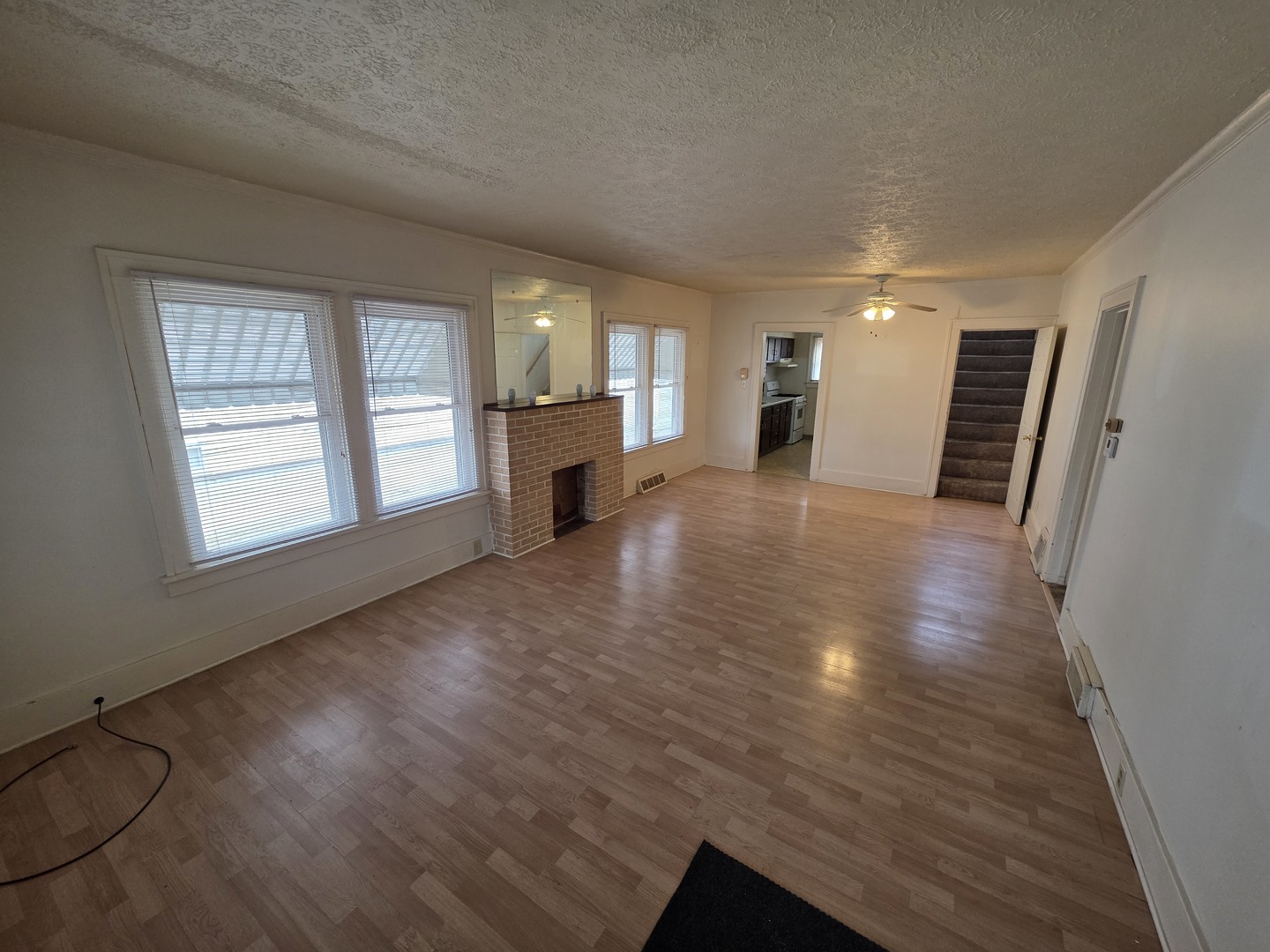 312 East 11th Street Sterling, IL 61081 - Photo 8 of 21 wooden floor in an empty room with a window