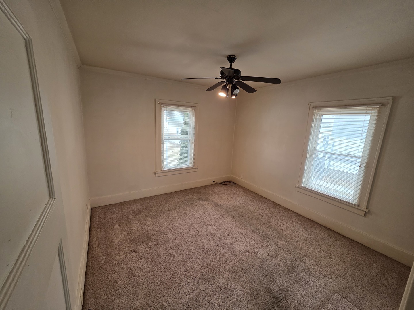 312 East 11th Street Sterling, IL 61081 - Photo 9 of 21 a view of an empty room with a window