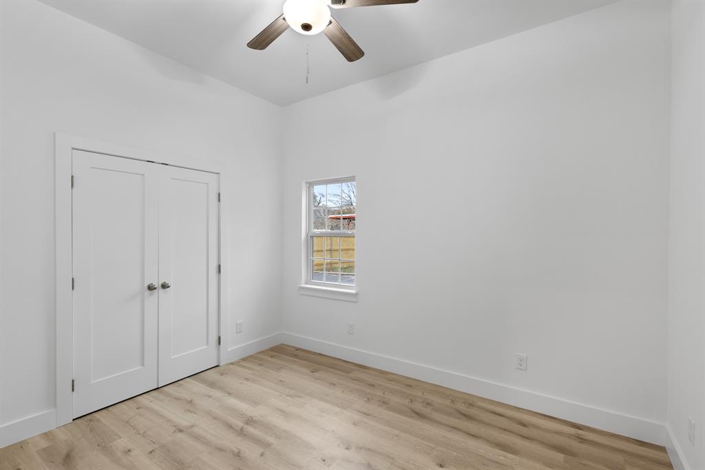 1812 Carpenter Street Bridgeport, TX 76426 - Photo 18 of 30 an empty room with a empty space and a window