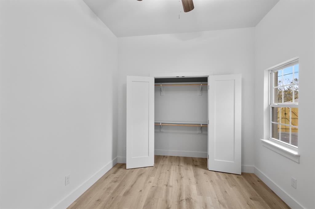 1812 Carpenter Street Bridgeport, TX 76426 - Photo 19 of 30 a view of an empty room and window and wooden floor
