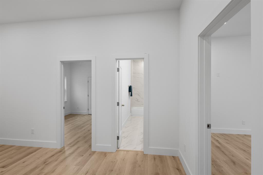 1812 Carpenter Street Bridgeport, TX 76426 - Photo 20 of 30 a view of a hallway with wooden floor
