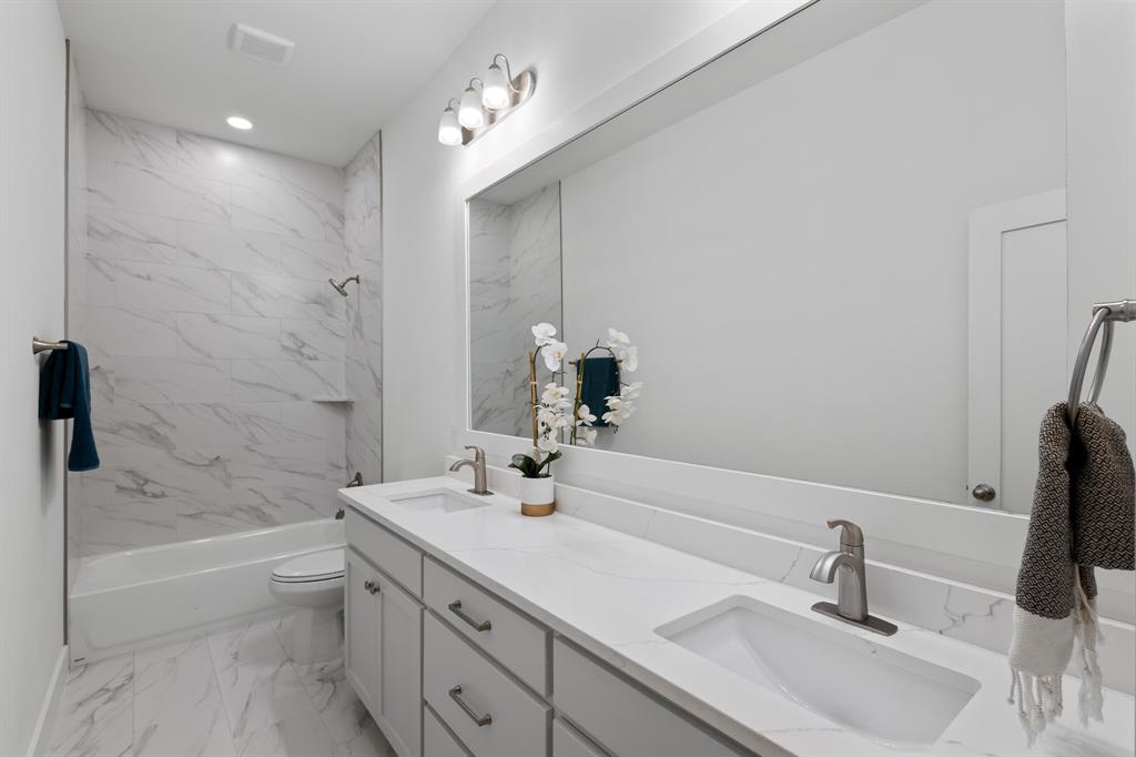 1812 Carpenter Street Bridgeport, TX 76426 - Photo 26 of 30 a bathroom with a sink and a mirror