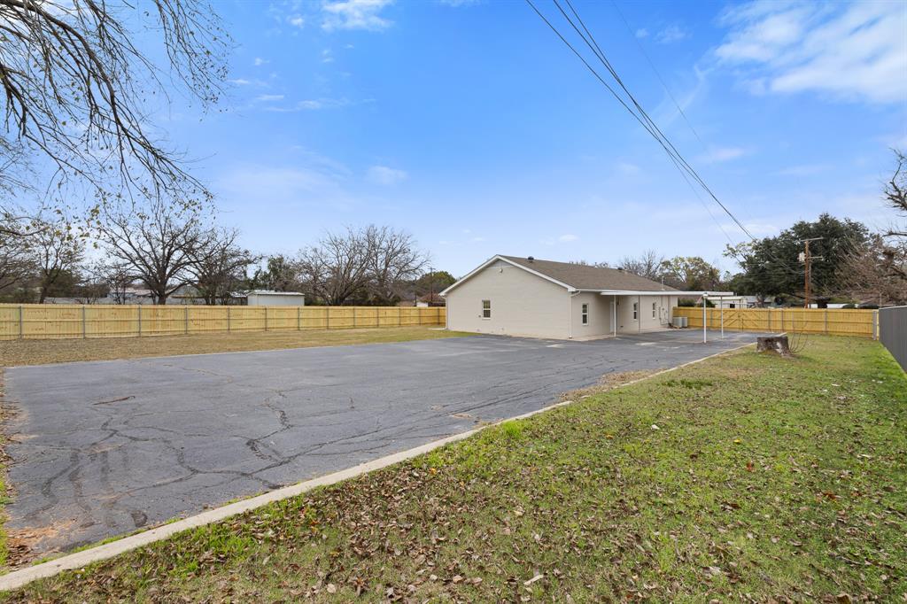 1812 Carpenter Street Bridgeport, TX 76426 - Photo 28 of 30 a view of a house with a yard