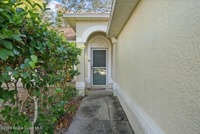 a view of a house with a small yard