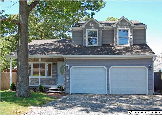 905 Patterson Road Point Pleasant, NJ 08742 - Photo 1 of 3 a front view of a house with a yard