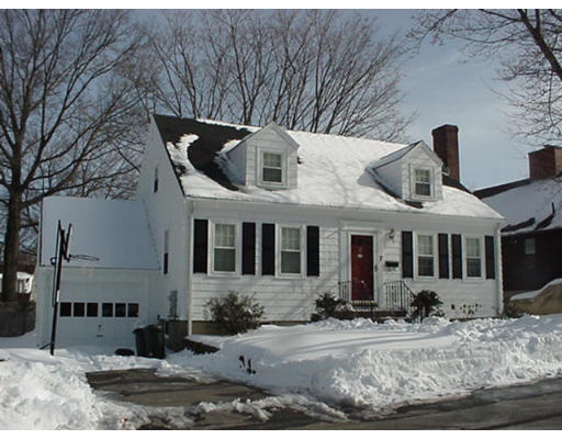 7 Stowecroft Road Arlington, MA 02474 - Photo 1 of 7 a front view of a house with large trees