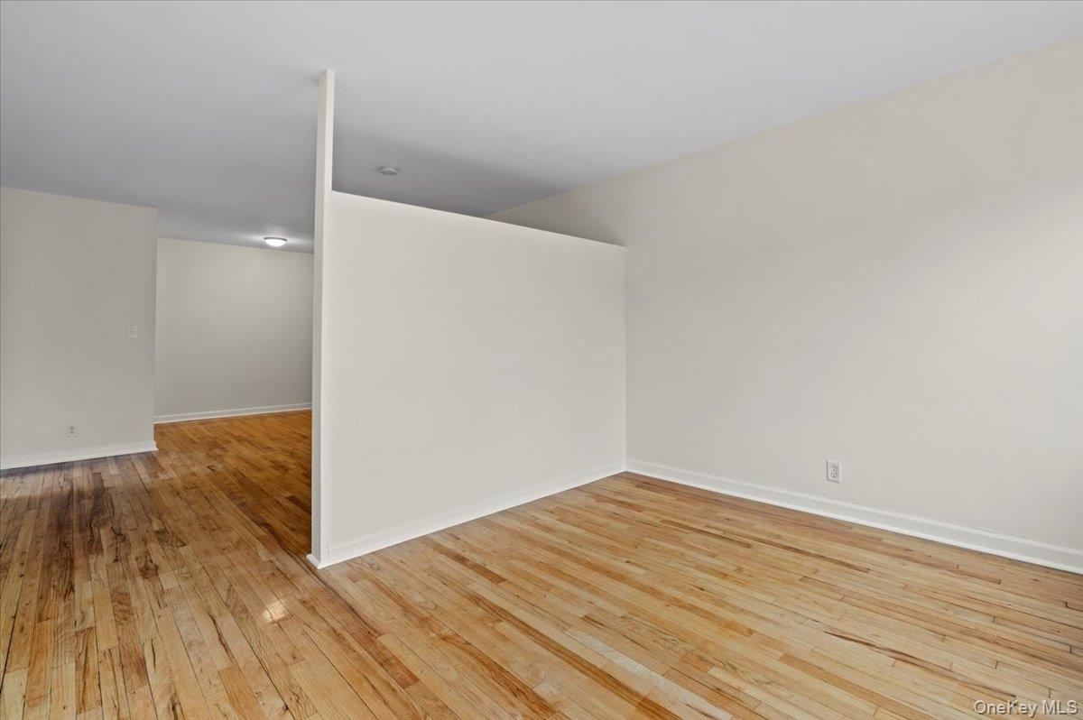 437 Pelham Road, Unit B2 New Rochelle, NY 10805 - Photo 4 of 17 a view of a big room with wooden floor