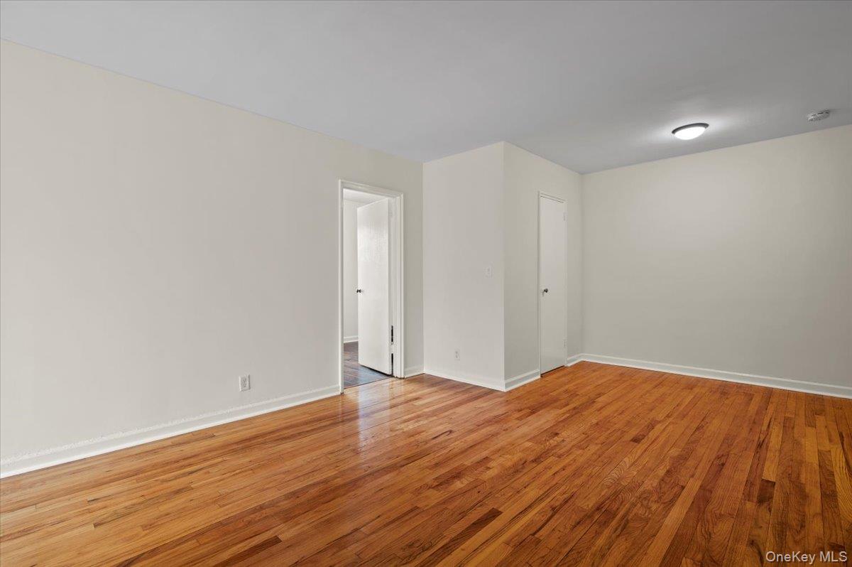 437 Pelham Road, Unit B2 New Rochelle, NY 10805 - Photo 9 of 17 a view of an empty room with wooden floor