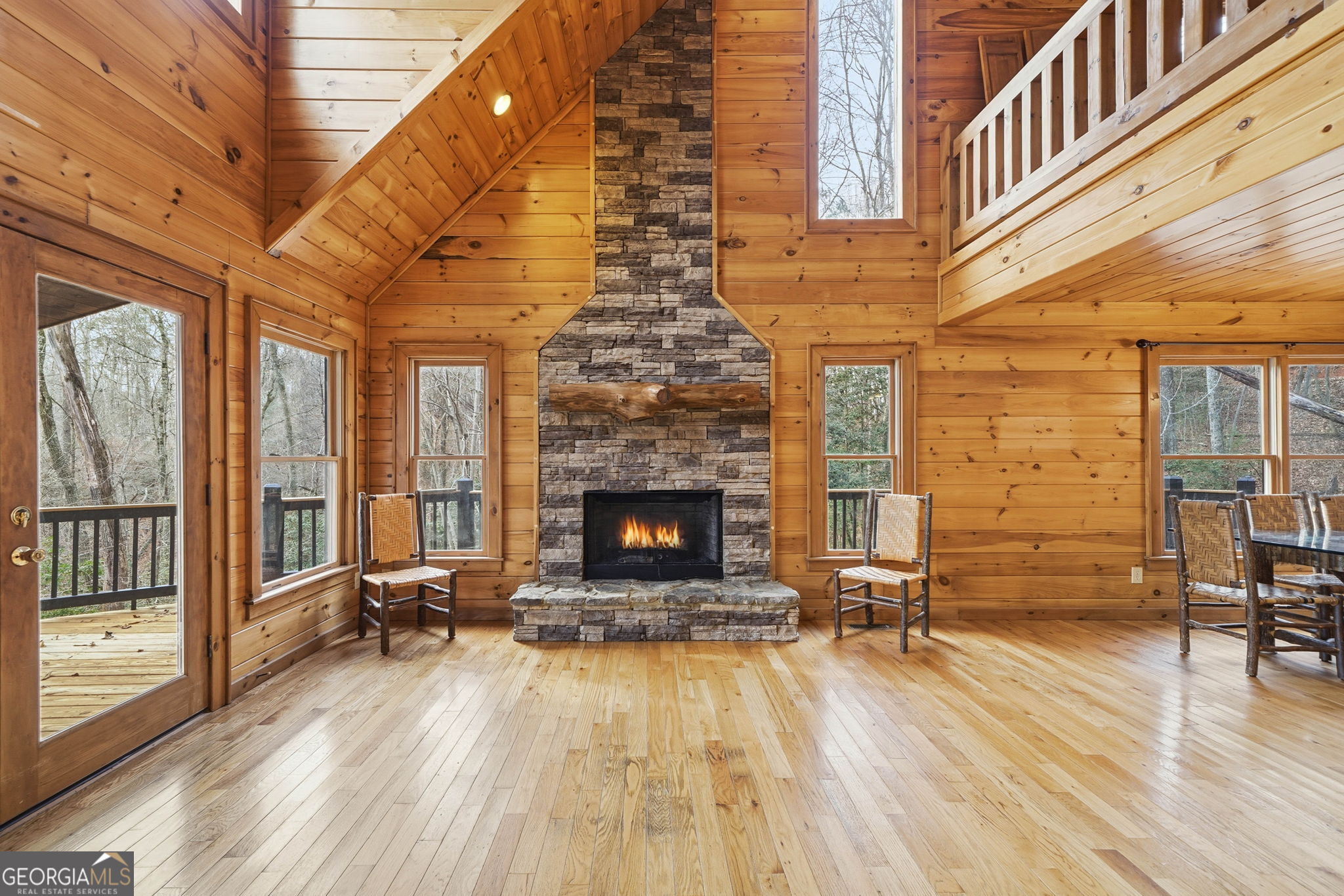 648 Stuart Mountain Road Mineral Bluff, GA 30559 - Photo 11 of 42 a living room with furniture fireplace and wooden floor