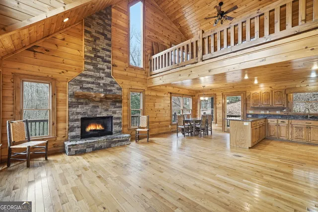 a view of dining room with furniture and fireplace