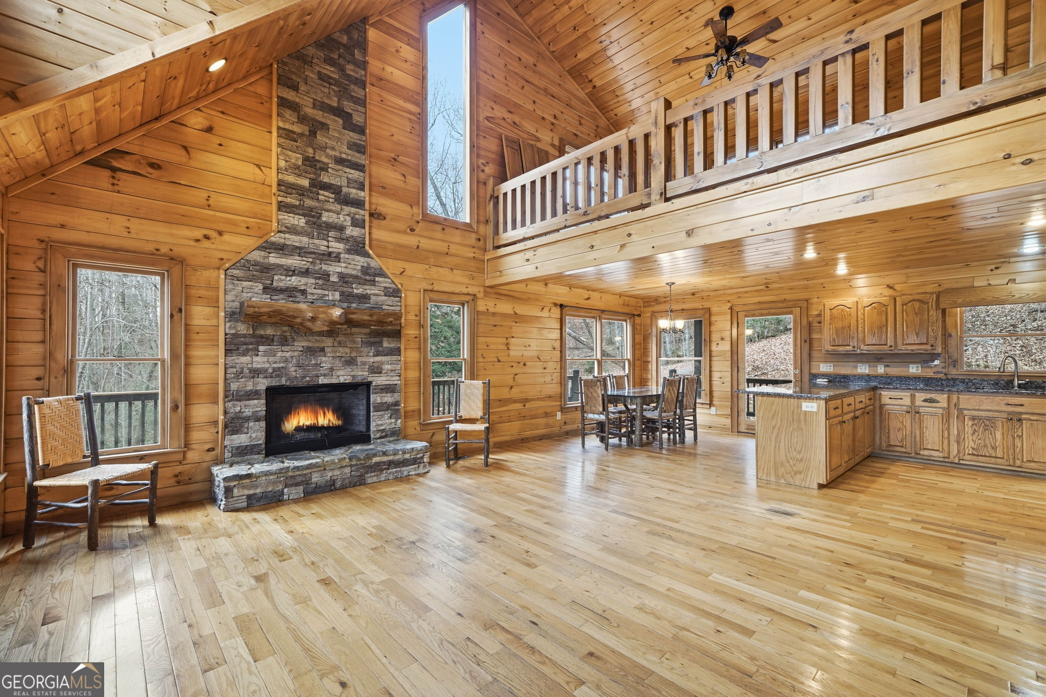 648 Stuart Mountain Road Mineral Bluff, GA 30559 - Photo 12 of 42 a view of dining room with furniture and fireplace