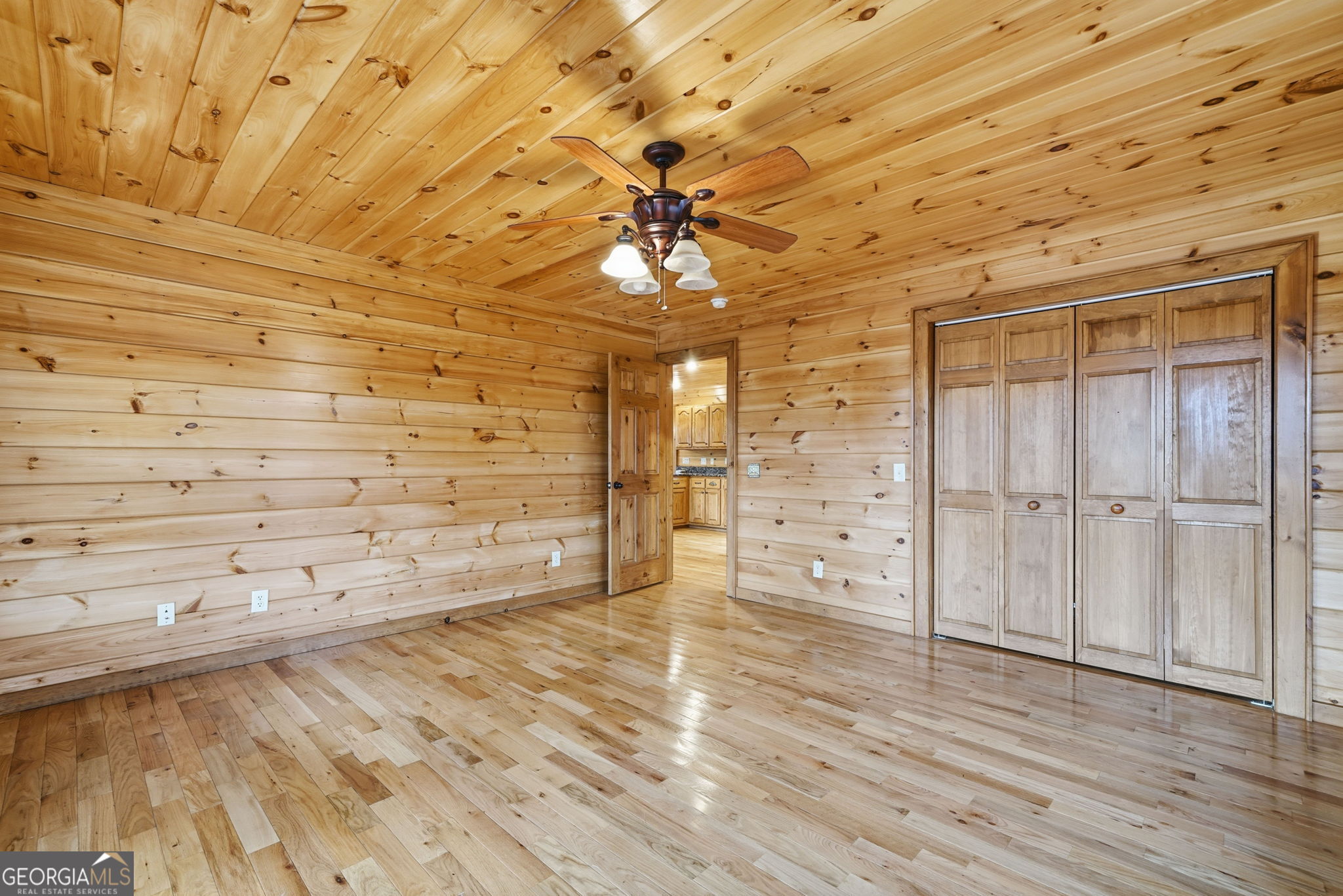 648 Stuart Mountain Road Mineral Bluff, GA 30559 - Photo 15 of 42 wooden floor in an empty room