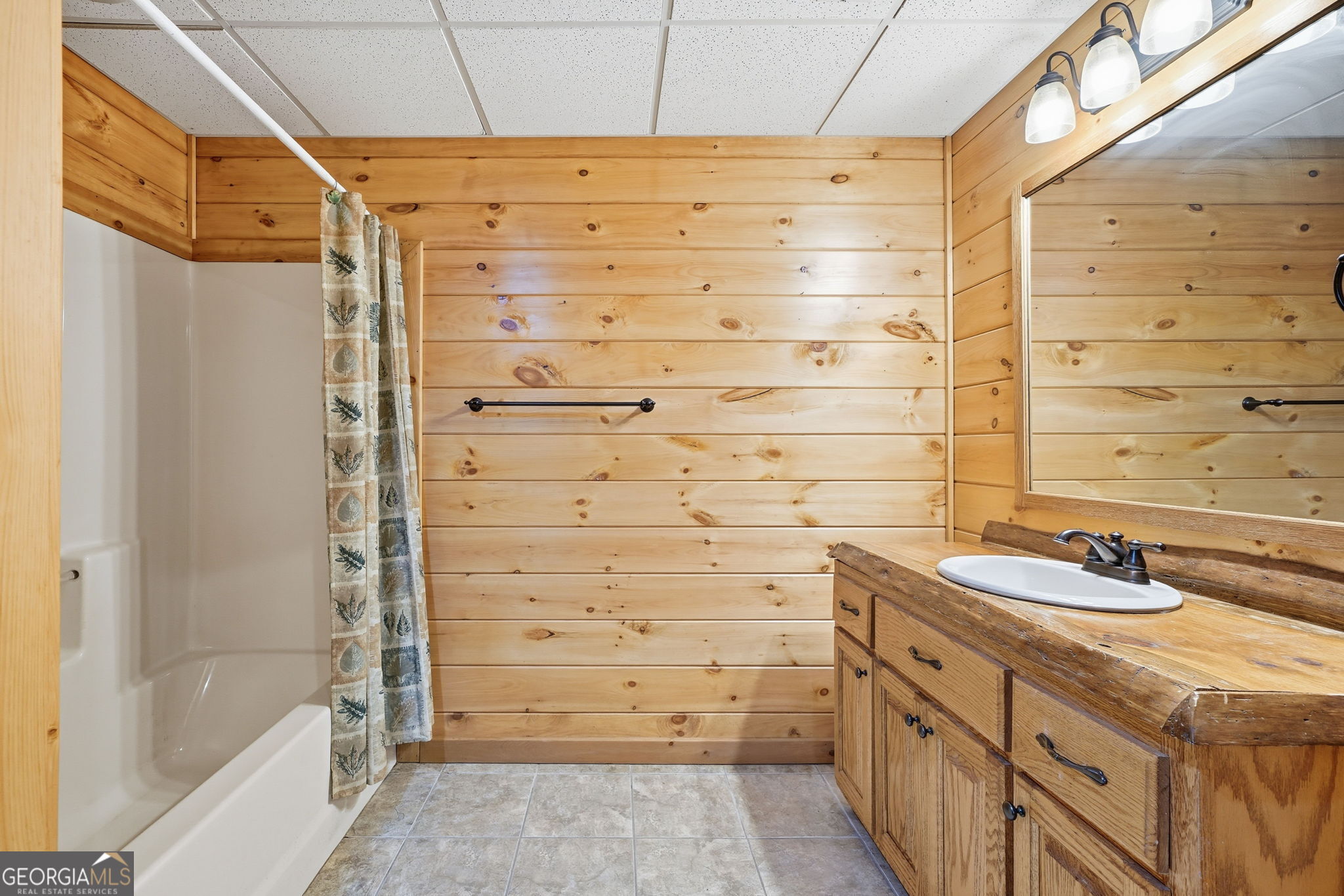 648 Stuart Mountain Road Mineral Bluff, GA 30559 - Photo 28 of 42 a bathroom with a sink and a shower