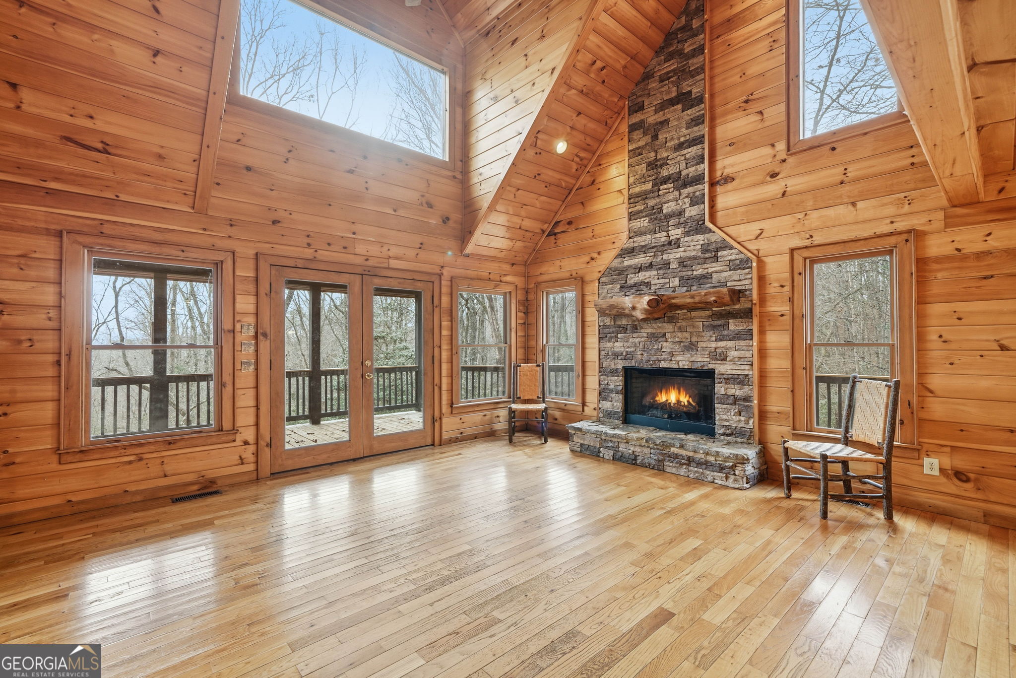 648 Stuart Mountain Road Mineral Bluff, GA 30559 - Photo 3 of 42 a view of a livingroom with wooden floor and a fireplace