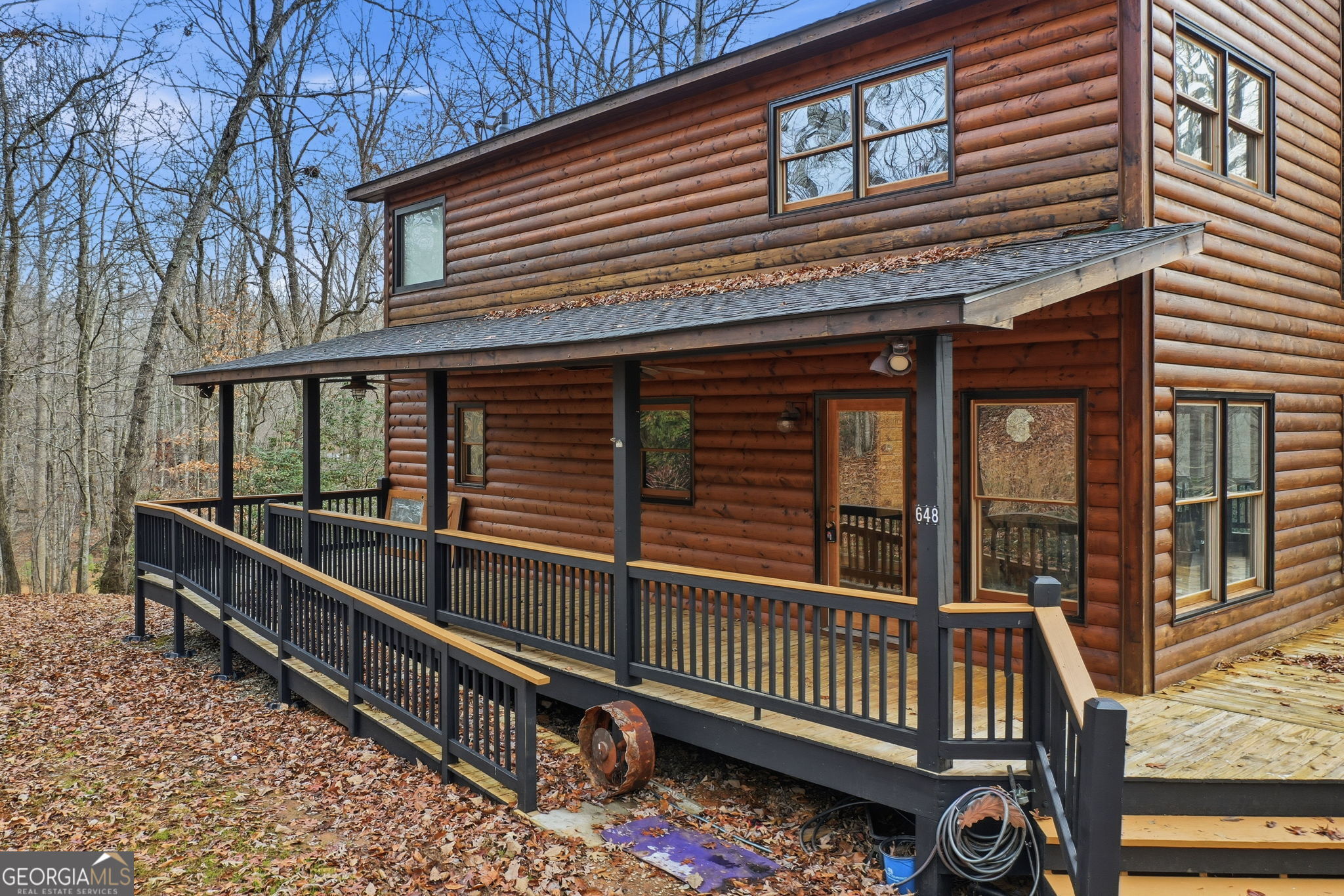 648 Stuart Mountain Road Mineral Bluff, GA 30559 - Photo 33 of 42 a view of a house with wooden fence