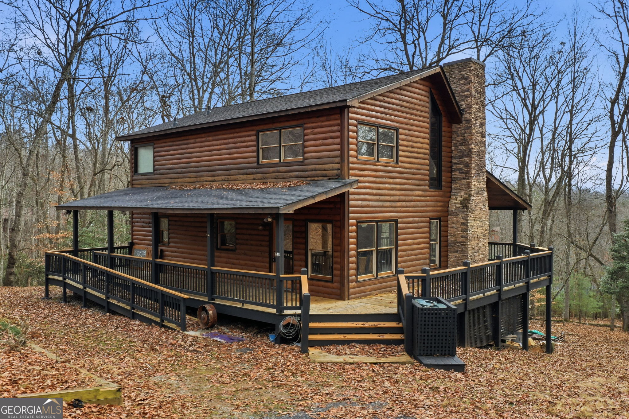 648 Stuart Mountain Road Mineral Bluff, GA 30559 - Photo 4 of 42 a front view of a house with balcony