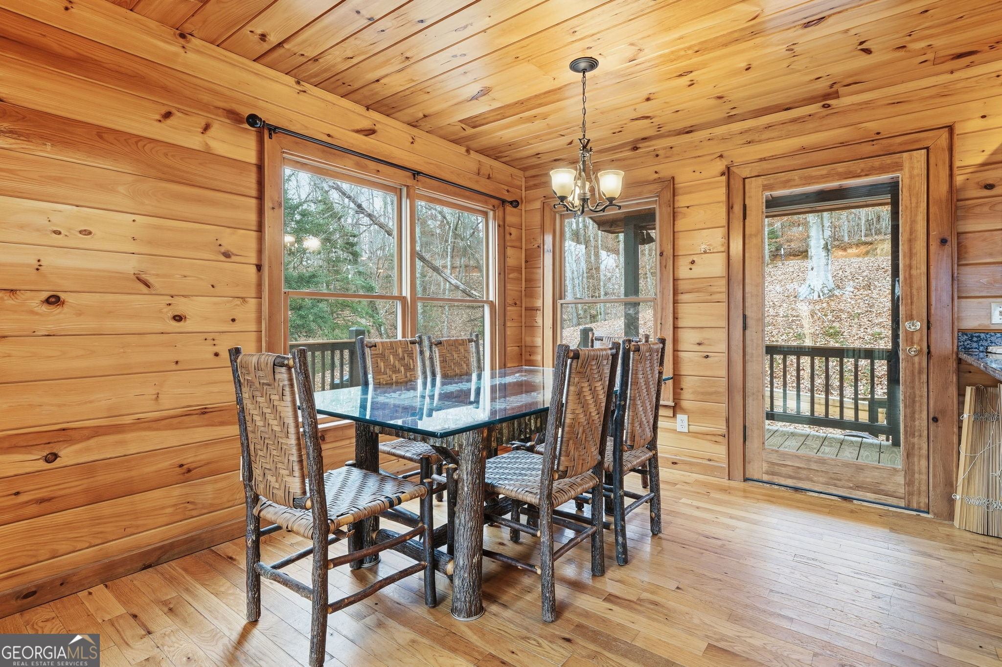 648 Stuart Mountain Road Mineral Bluff, GA 30559 - Photo 9 of 42 a view of a dining room with furniture window and wooden floor