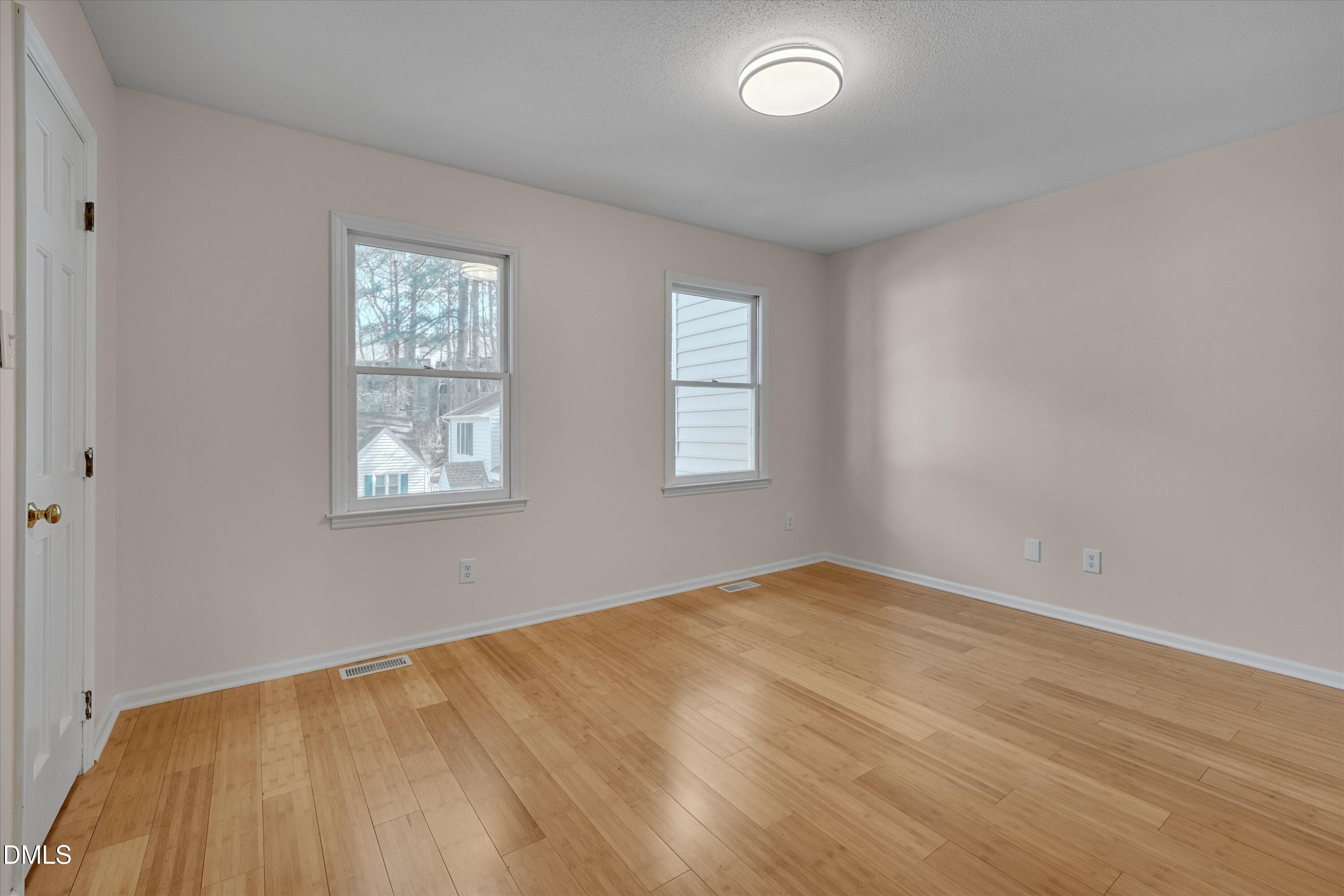 6528 Hearthstone Drive Raleigh, NC 27615 - Photo 16 of 32 an empty room with windows