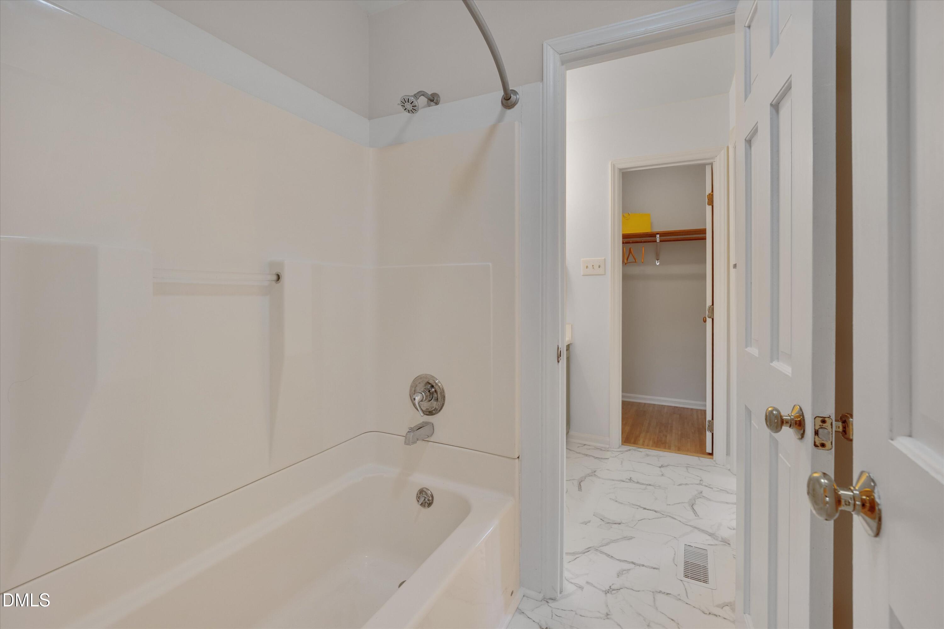 6528 Hearthstone Drive Raleigh, NC 27615 - Photo 19 of 32 a bathroom with a bathtub